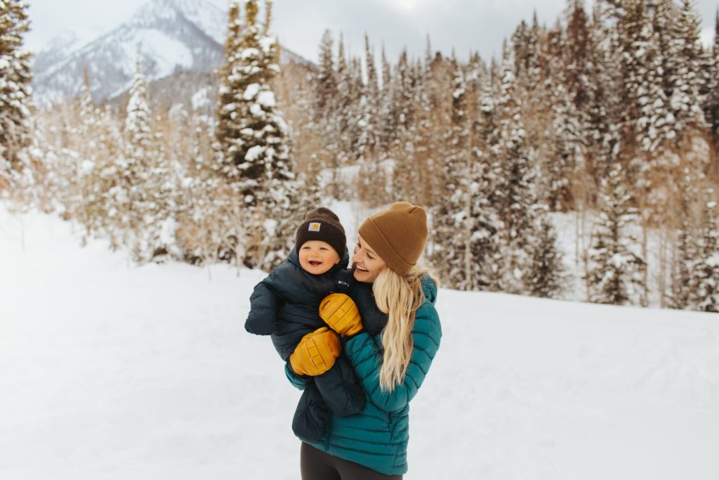 Mom and baby out winter hiking together