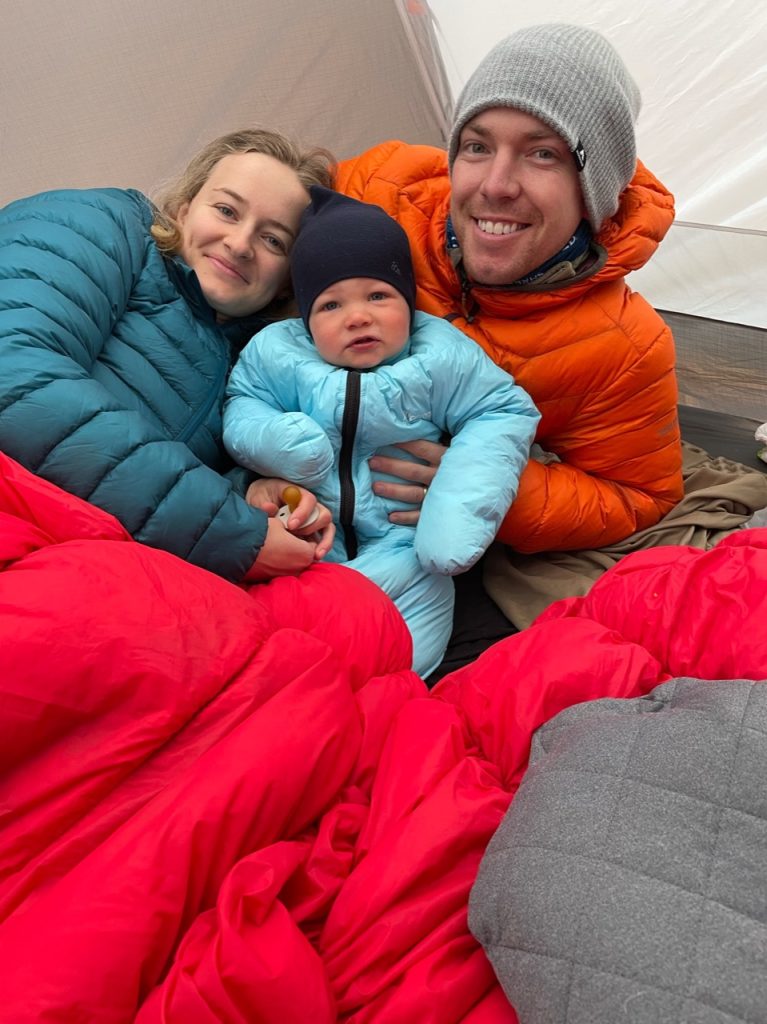 hailey, her husband, and toddler in their sleeping bags in the tent