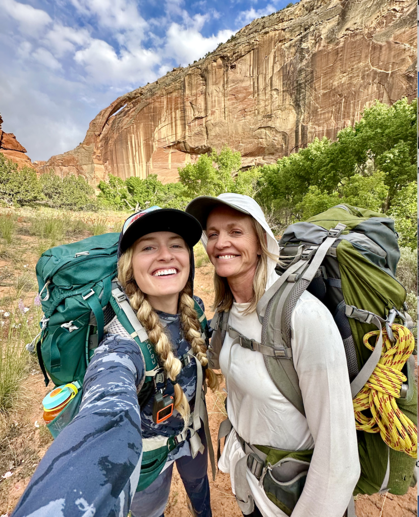 hailey and her mom hiking in the summer in the desert